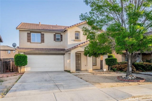 14051 Mare Ln, Victorville, CA 92394 - mediterranean / spanish house with a tiled roof, a garage, driveway, and stucco siding