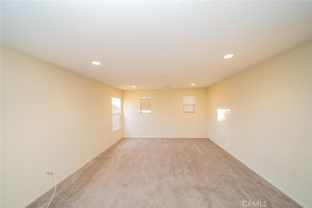 14051 Mare Ln, Victorville, CA 92394 - empty room with light carpet and recessed lighting