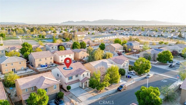 14051 Mare Ln, Victorville, CA 92394 - aerial perspective of suburban area with a mountainous background