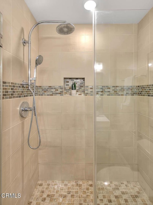 full bathroom with a shower stall