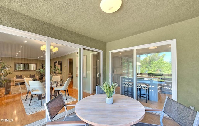 sunroom with a chandelier