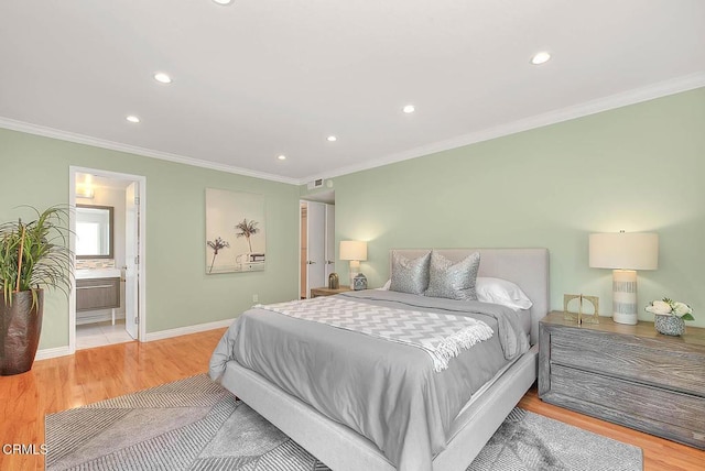 bedroom with ornamental molding, baseboards, light wood-style flooring, and recessed lighting