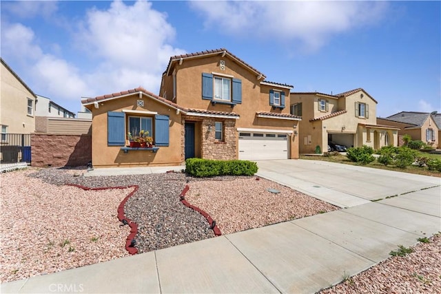 view of front of property with a tile roof, driveway, stone siding, an attached garage, and stucco siding