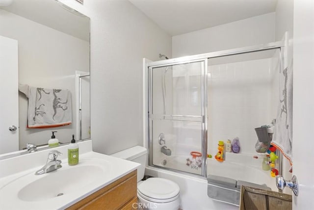 1441 Paseo Orion, San Diego, CA 92154 - bathroom featuring toilet, shower / bath combination with glass door, and vanity