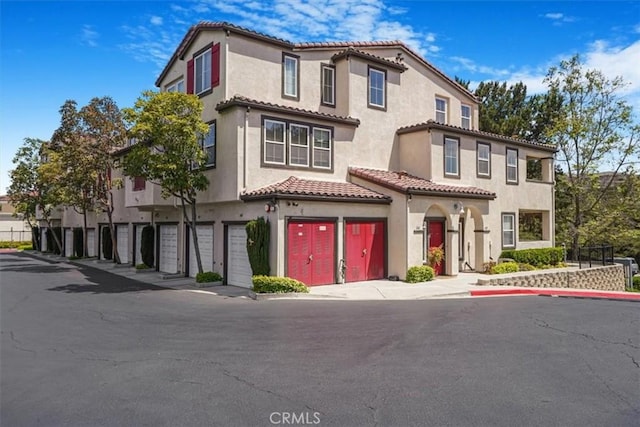 1441 Paseo Orion, San Diego, CA 92154 - view of front of property featuring a garage, stucco siding, and a tile roof