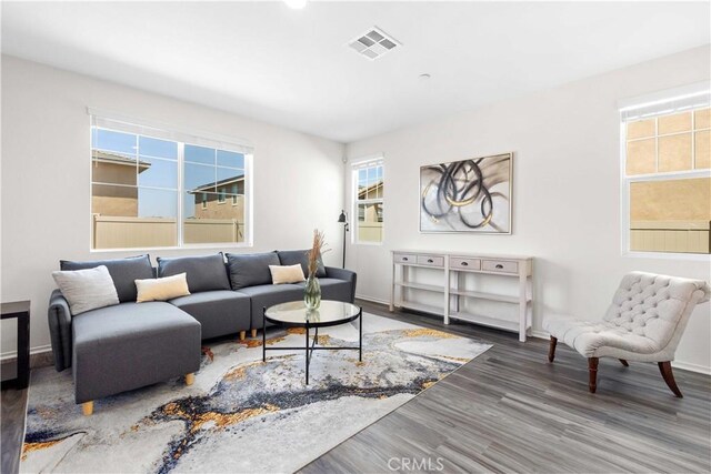 3308 Jack Rabbit Ct, Perris, CA 92570 - living area with baseboards, wood finished floors, and visible vents