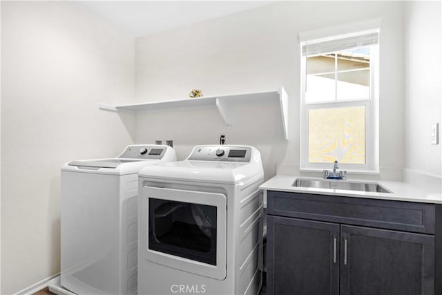 3308 Jack Rabbit Ct, Perris, CA 92570 - clothes washing area with cabinet space, washing machine and clothes dryer, and a sink