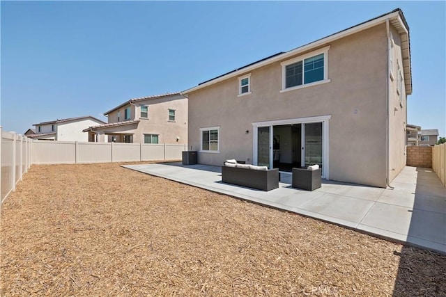 3308 Jack Rabbit Ct, Perris, CA 92570 - rear view of property with a fenced backyard, central AC, a patio, stucco siding, and an outdoor living space