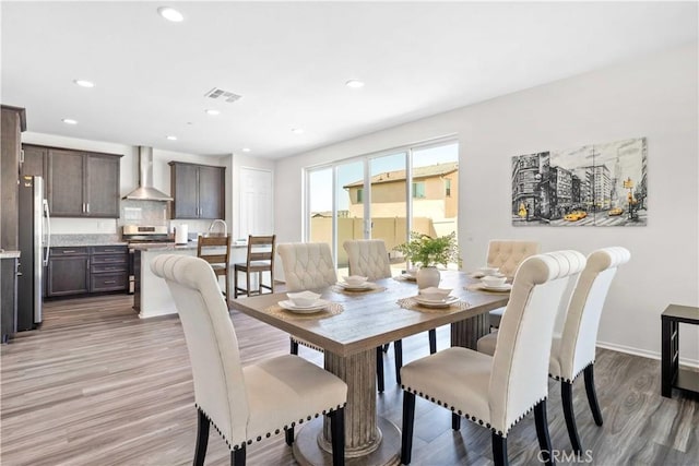 3308 Jack Rabbit Ct, Perris, CA 92570 - dining area with light wood-type flooring, baseboards, visible vents, and recessed lighting
