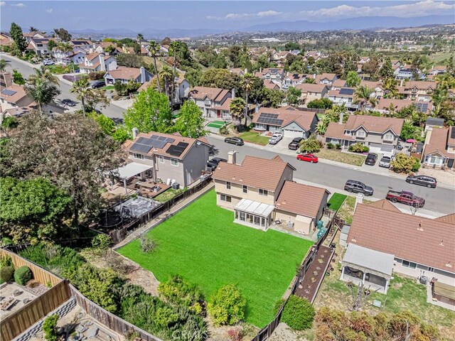 birds eye view of property with a residential view