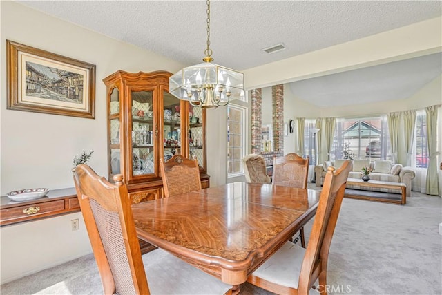 1426 Crestview Dr, Oceanside, CA 92056 - dining space with a chandelier, carpet, a textured ceiling, and vaulted ceiling