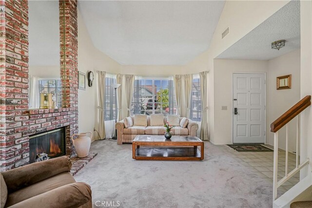 1426 Crestview Dr, Oceanside, CA 92056 - carpeted living room with a fireplace and stairway
