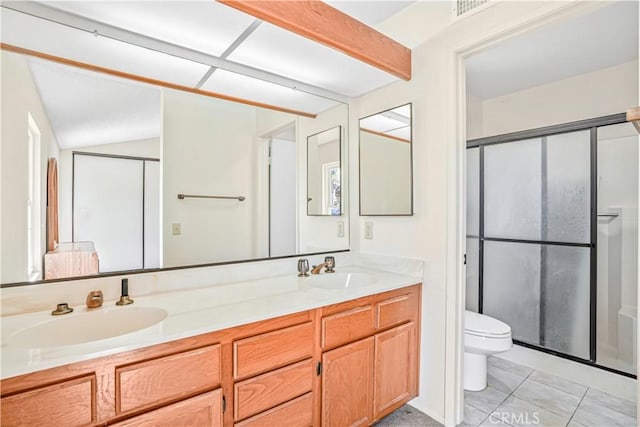 ensuite bathroom with a sink, a shower stall, toilet, and ensuite bath