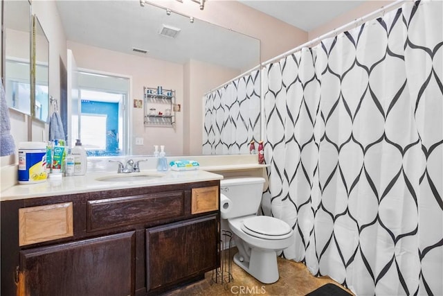 full bath with visible vents, toilet, vanity, and tile patterned floors
