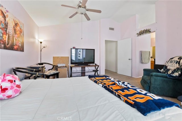 bedroom with visible vents, carpet flooring, and high vaulted ceiling