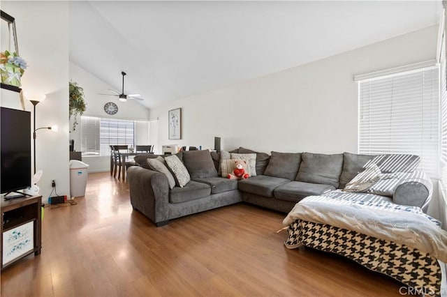 living room featuring wood finished floors, high vaulted ceiling, and ceiling fan