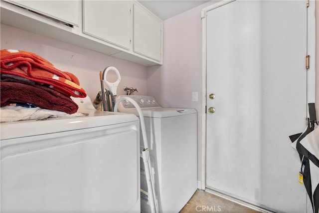 laundry room with cabinet space and independent washer and dryer