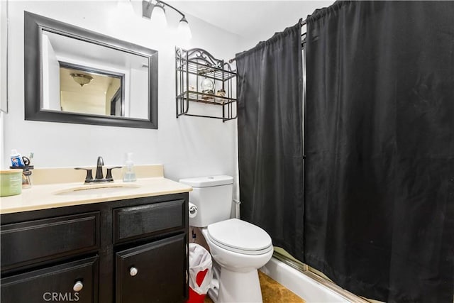 bathroom with toilet, vanity, and curtained shower