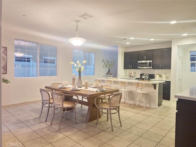 dining room with light tile patterned floors, recessed lighting, and visible vents