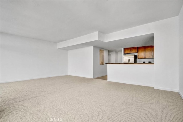 411 W Seaside Way Unit 1804, Long Beach, CA 90802 - unfurnished living room with light colored carpet and baseboards