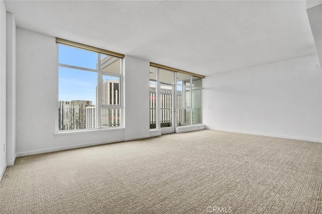 411 W Seaside Way Unit 1804, Long Beach, CA 90802 - carpeted spare room with healthy amount of natural light and baseboards