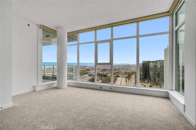411 W Seaside Way Unit 1804, Long Beach, CA 90802 - unfurnished sunroom with carpet flooring, a water view, and baseboards