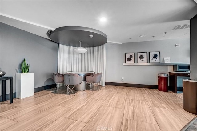 411 W Seaside Way Unit 1804, Long Beach, CA 90802 - dining area featuring baseboards and wood finished floors