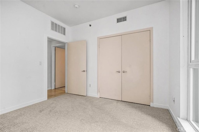 411 W Seaside Way Unit 1804, Long Beach, CA 90802 - unfurnished bedroom featuring light carpet and baseboards