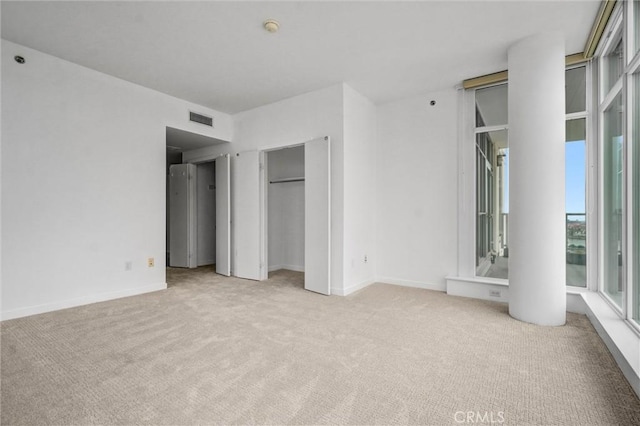 411 W Seaside Way Unit 1804, Long Beach, CA 90802 - unfurnished bedroom featuring light colored carpet and baseboards