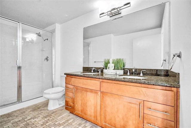 411 W Seaside Way Unit 1804, Long Beach, CA 90802 - bathroom featuring double vanity, a shower stall, and toilet