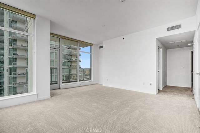 411 W Seaside Way Unit 1804, Long Beach, CA 90802 - carpeted empty room with a wall of windows