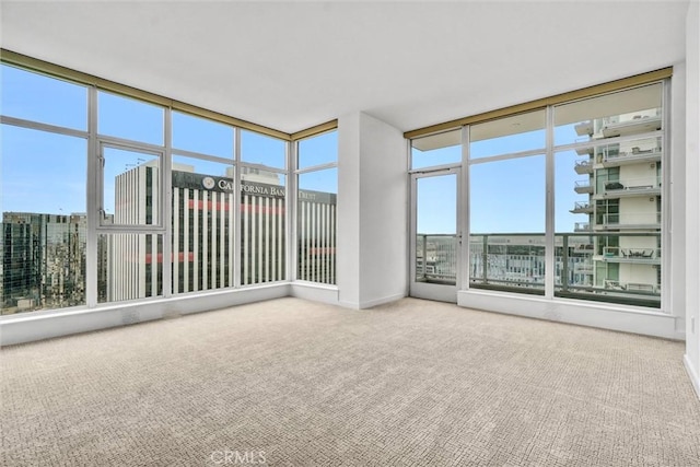 411 W Seaside Way Unit 1804, Long Beach, CA 90802 - unfurnished sunroom featuring carpet flooring and a wall of windows