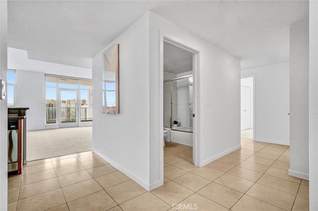 411 W Seaside Way Unit 1804, Long Beach, CA 90802 - hall with light tile patterned flooring and baseboards