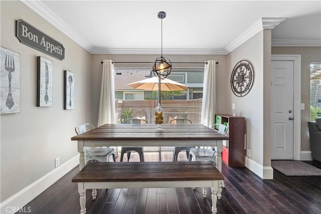 dining area with wood finished floors, baseboards, and ornamental molding