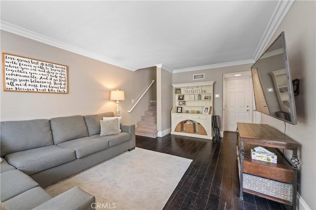 living area with stairs, hardwood / wood-style flooring, baseboards, ornamental molding, and visible vents