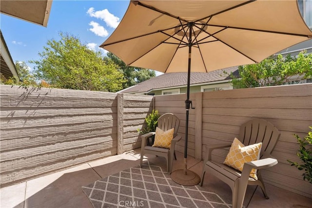 view of patio / terrace with fence