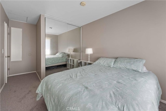 bedroom featuring baseboards, carpet flooring, and a closet