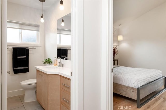 bathroom featuring toilet and vanity