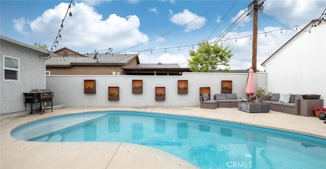 view of pool with a fenced in pool, a grill, fence, a patio area, and an outdoor hangout area