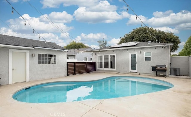 view of swimming pool with a fenced backyard, a fenced in pool, and a patio