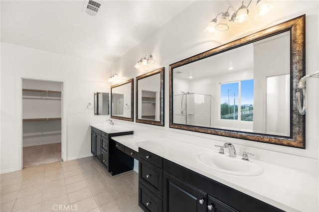 37544 River Oats Ln, Murrieta, CA 92563 - full bath with a sink, a stall shower, baseboards, tile patterned flooring, and two vanities