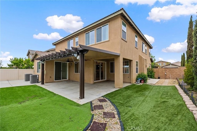 37544 River Oats Ln, Murrieta, CA 92563 - back of property featuring stucco siding, a ceiling fan, a fenced backyard, and a lawn