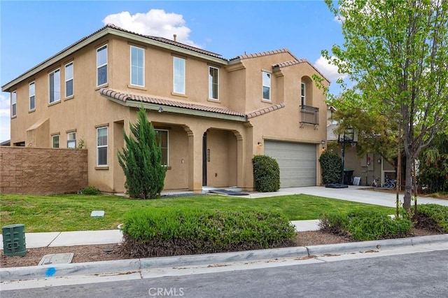 37544 River Oats Ln, Murrieta, CA 92563 - mediterranean / spanish house with concrete driveway, stucco siding, a tile roof, a front yard, and a garage