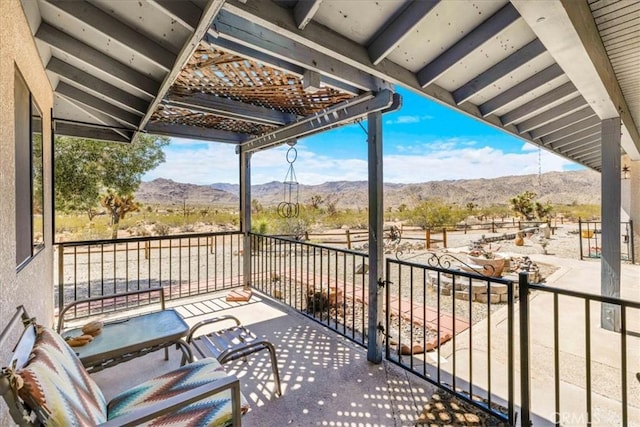 balcony featuring a mountain view