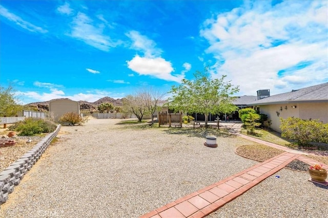 view of yard featuring fence and a patio area