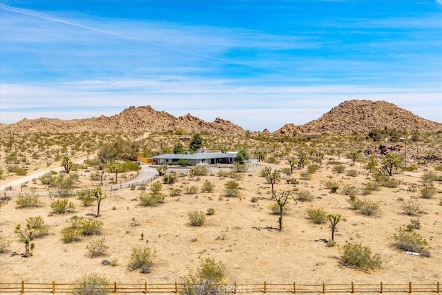 mountain view featuring view of desert and a rural view