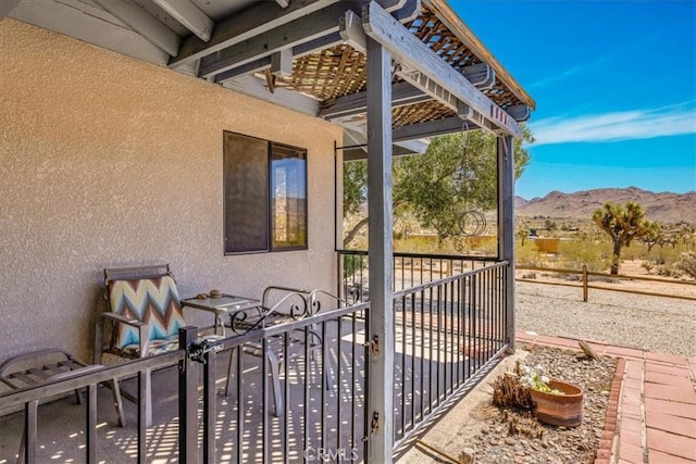 view of patio / terrace with a mountain view