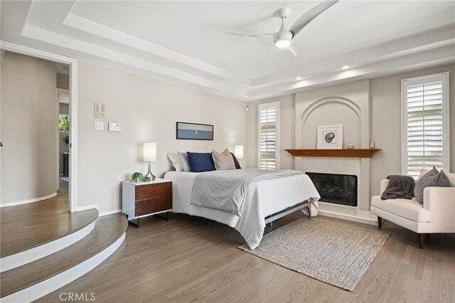 804 N Juanita Ave Unit B, Redondo Beach, CA 90277 - bedroom featuring multiple windows, wood finished floors, a tray ceiling, and recessed lighting