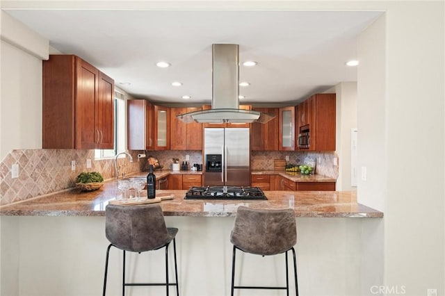 804 N Juanita Ave Unit B, Redondo Beach, CA 90277 - kitchen with island range hood, a peninsula, light stone countertops, and stainless steel appliances