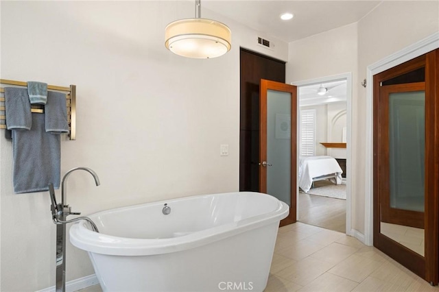 804 N Juanita Ave Unit B, Redondo Beach, CA 90277 - bathroom featuring a freestanding tub, baseboards, connected bathroom, and visible vents